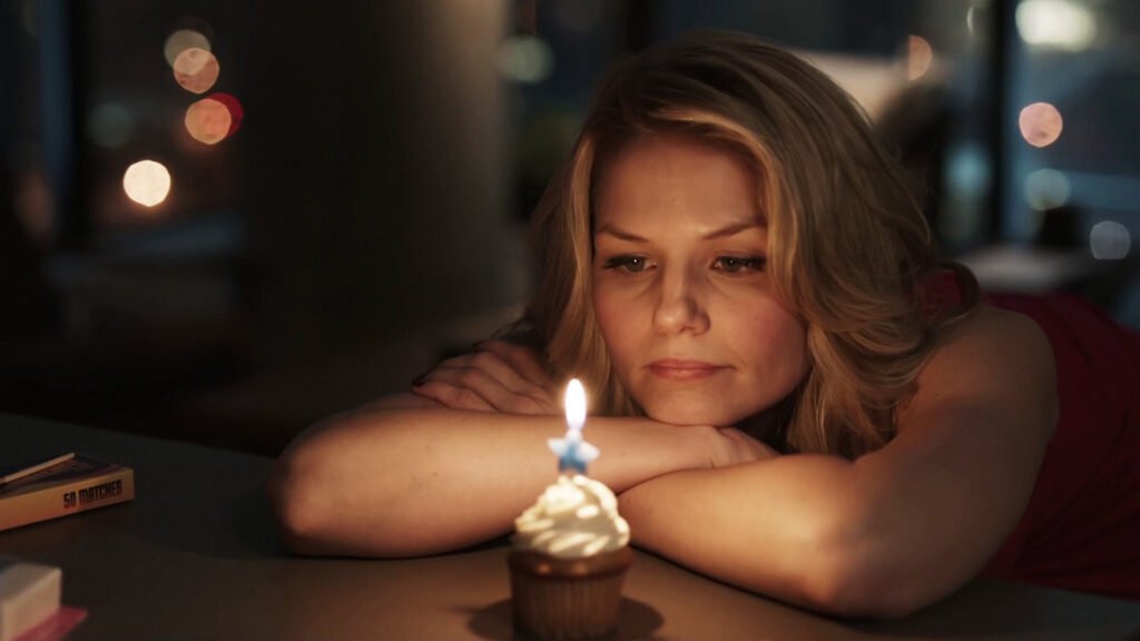 Emma Swan stares at her birthday candle